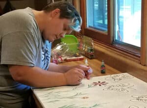 Gina working on a creative project