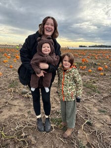 Rebecca enjoying a pumpkin patch with her boys