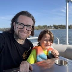 andrew-with-son-boating