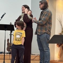 family-dedicating-baby-son-at-church